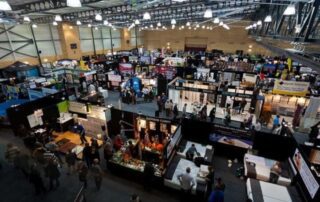Trade show using carpet tiles for gym floor protection